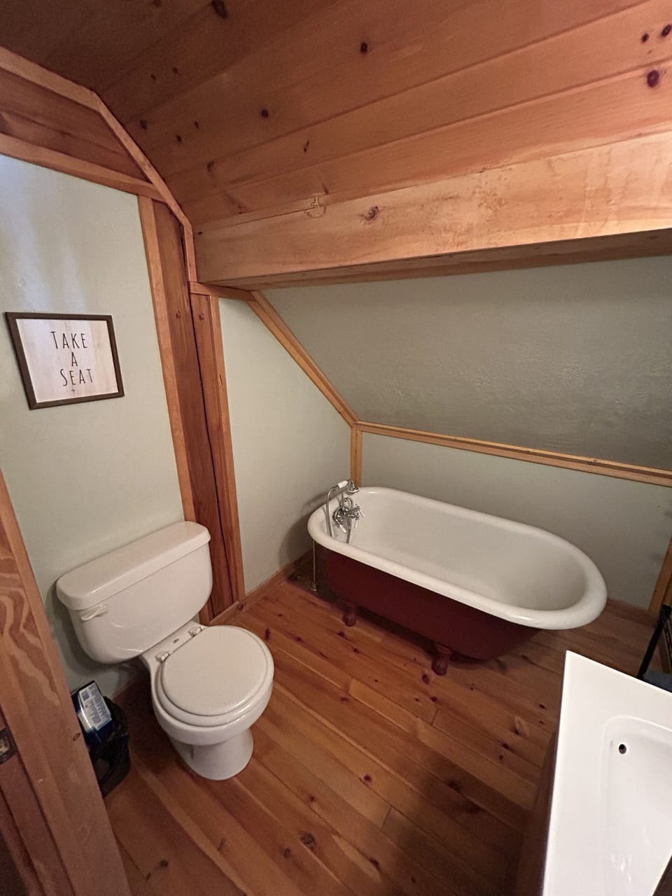 Vintage claw foot tub perfect for a warm relaxing bath with a hand sprayer.