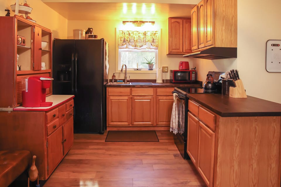 Our cozy kitchen with butcher block counters and modern appliances