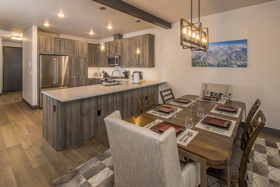 Dining table with seating for 6, two additional chairs for larger parties. | Main Level