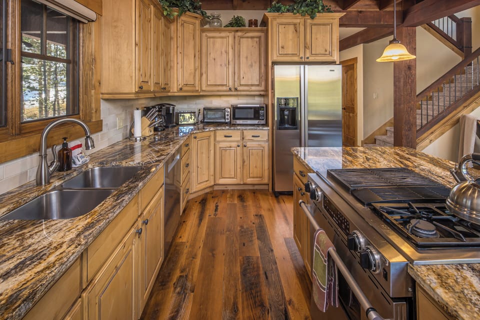 A large kitchen featuring all stainless steel appliances, perfect for cooking your favorite meals. | Main Level