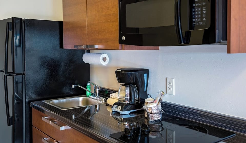 Enjoy convenient in-room cooking with streamlined appliances and counter space.
