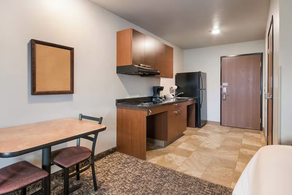 Gather for quick meals at the convenient table and kitchenette.