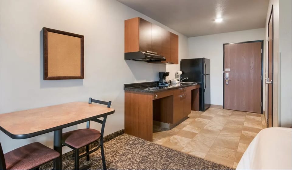 Enjoy simple meals with kitchenette, fridge, and dining table.