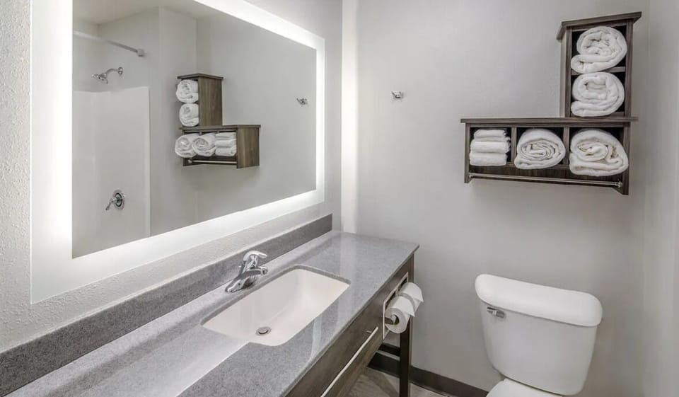 Refresh easily with a bright vanity and neatly stocked towels