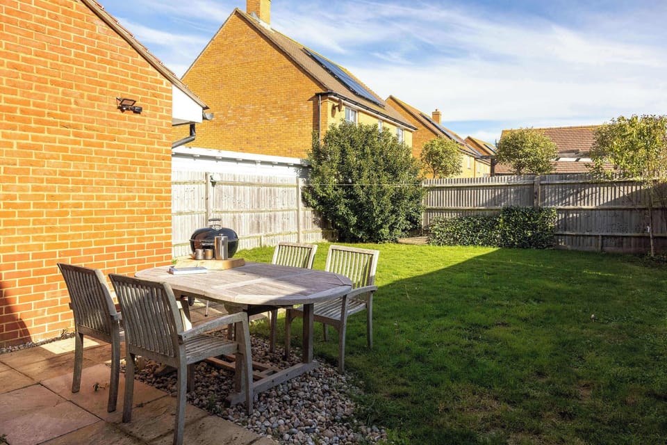 Garden with outdoor furniture and BBQ, perfect for quality family time.
