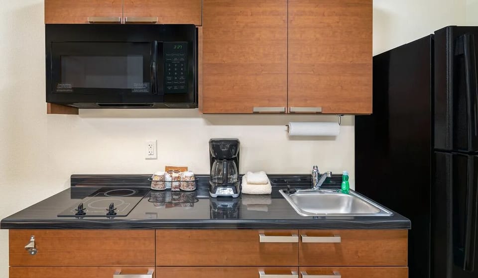 Fuel your stay with microwave, fridge, and handy prep space.