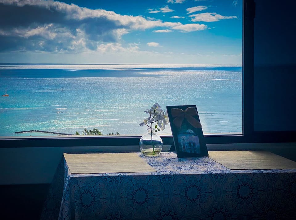 The dining table can be moved to the window for an ocean view while working.