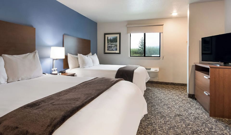 Settle in for a restful night with cozy double-queen comfort.