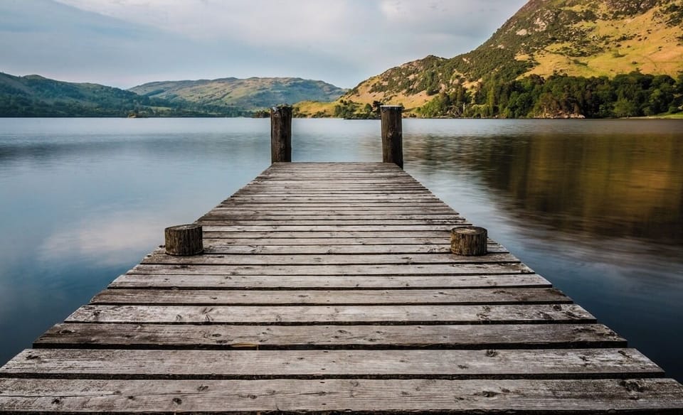 Unwind on the dock as calm lake views glow.