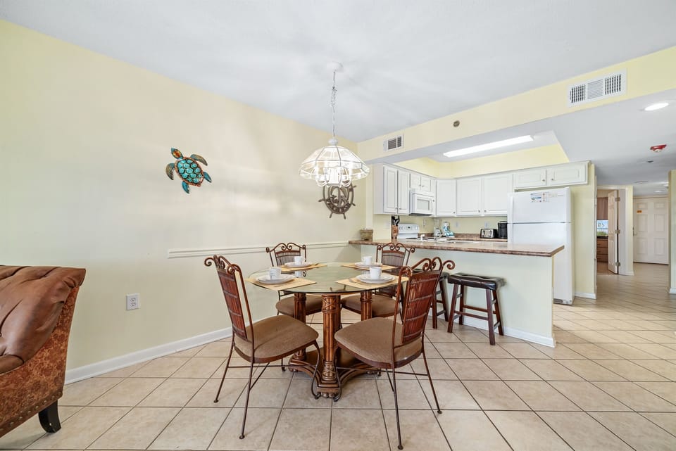 Gather, eat, and make memories. Our spacious dining area and adjacent breakfast bar provide plenty of room for guests to enjoy meals and conversations, creating the perfect setting for your vacation.