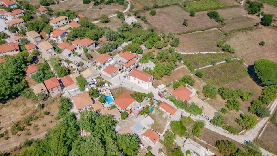 Panoramic Aerial Shot of Traditional Greek Village & Countryside
A scenic aerial view showcasing the authentic village setting, rolling hills, olive groves, and peaceful rural landscape.