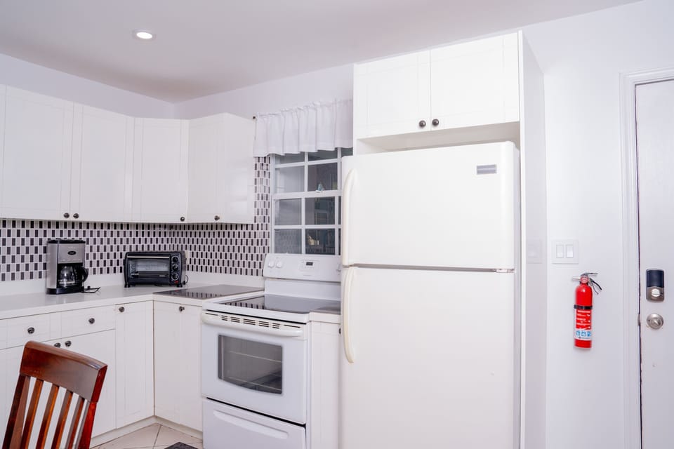 Bright and open kitchen-dining area, ready for your culinary skills.