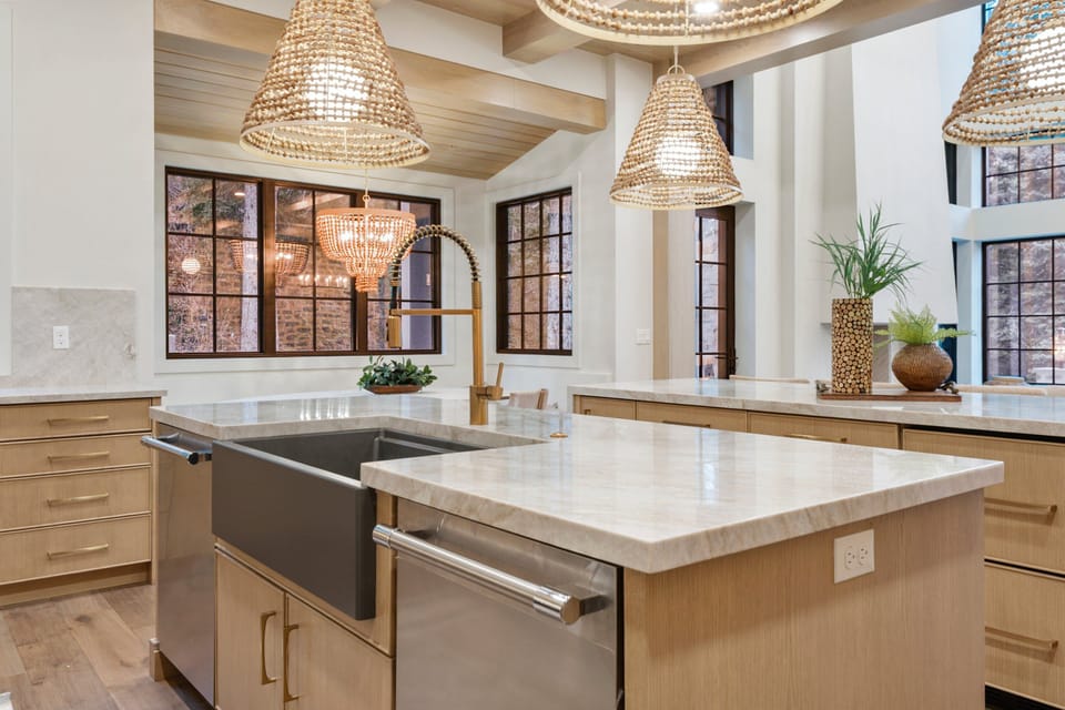 A huge chef's kitchen is well stocked with premium appliances and supplies, two kitchen islands, a built in dining area with beautiful alpine views.