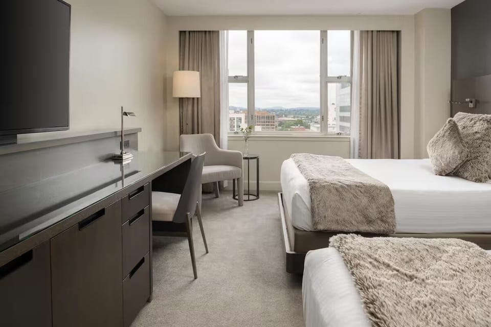 Sink into plush beds and wake up to city views.