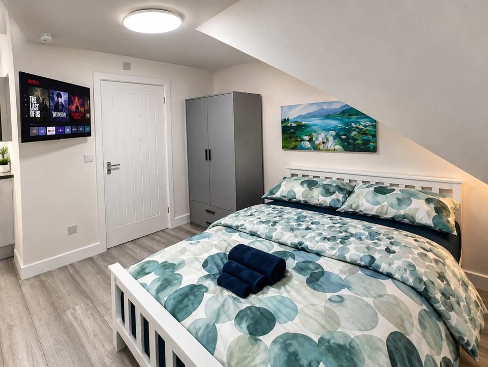 Bedroom : Plush Double Bed, Wardrobe & Smart TV , enjoy a restful night in a cozy, private retreat.