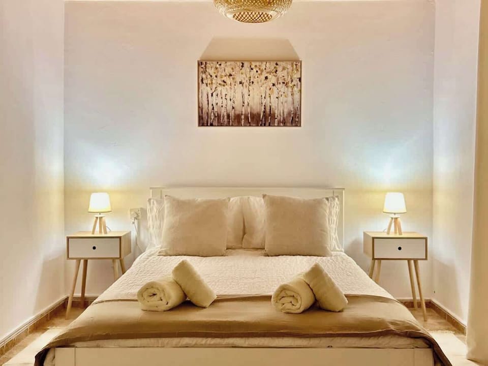 A cozy retreat with a large double bed, high-quality bedding, extra pillows, and blackout blinds. Includes a double wardrobe, air conditioning, and heating for year-round comfort.