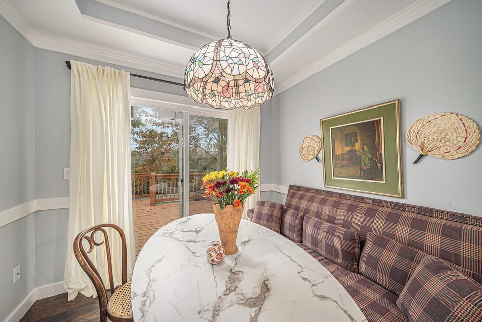 Cozy breakfast nook with natural light and relaxing seating.