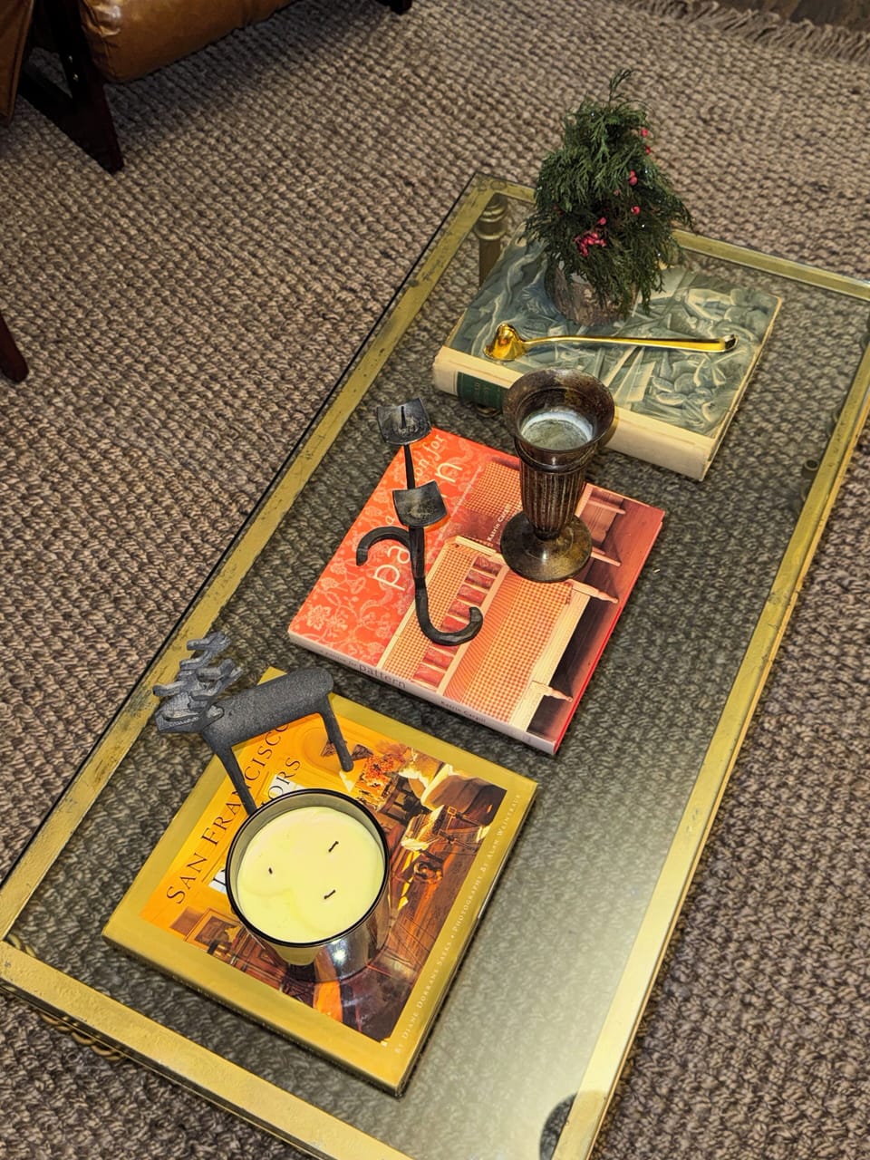 A styled coffee table with books and decor, creating a warm and inviting living 