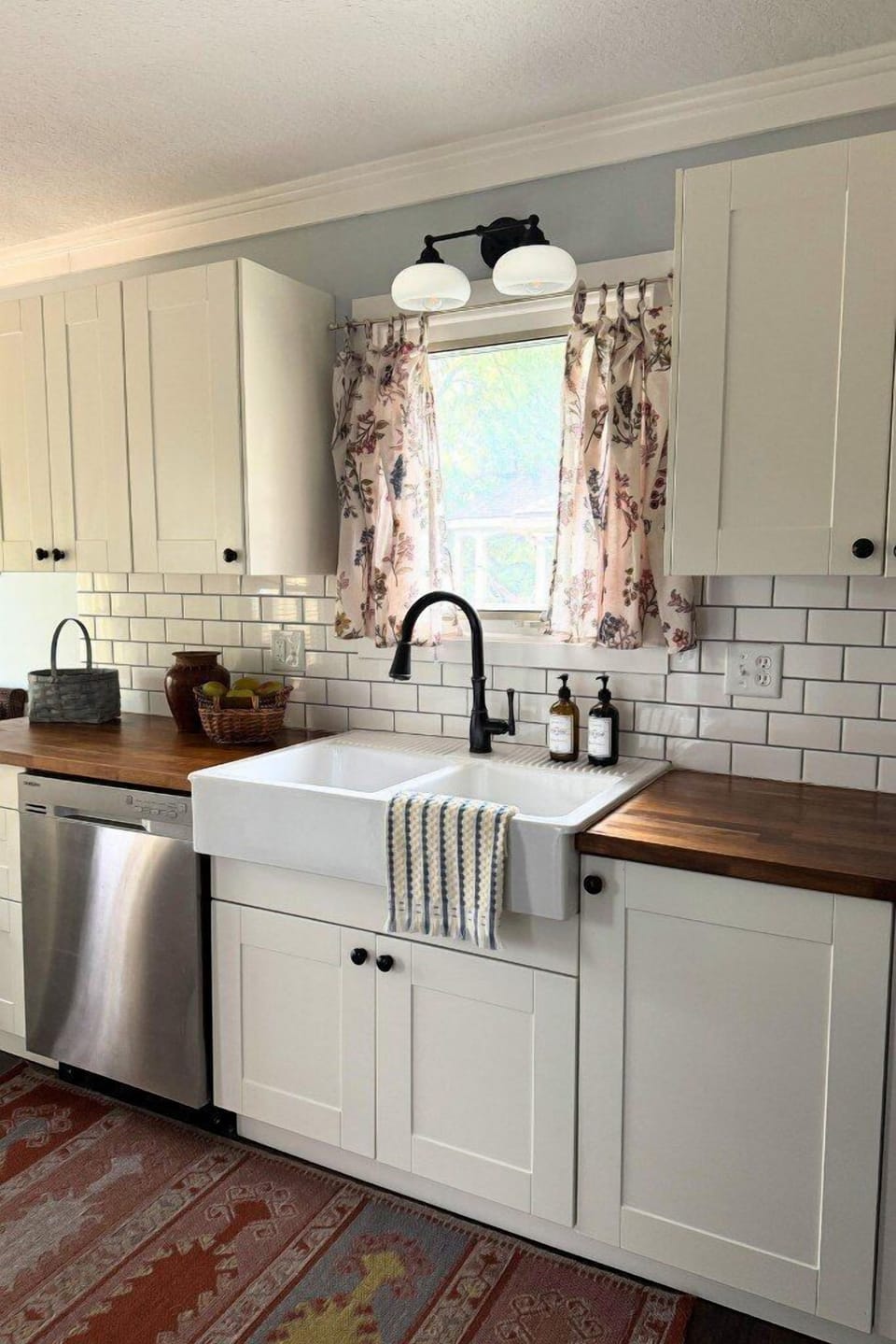 Charming farmhouse sink with warm wood counters and natural light.