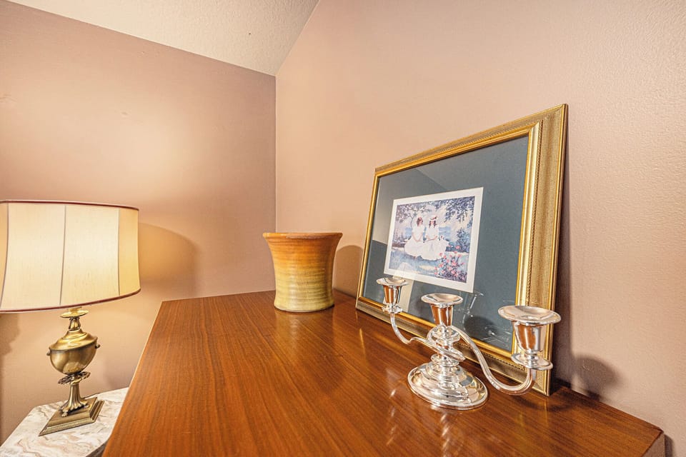 Elegant dresser setup with framed art and welcoming decor.