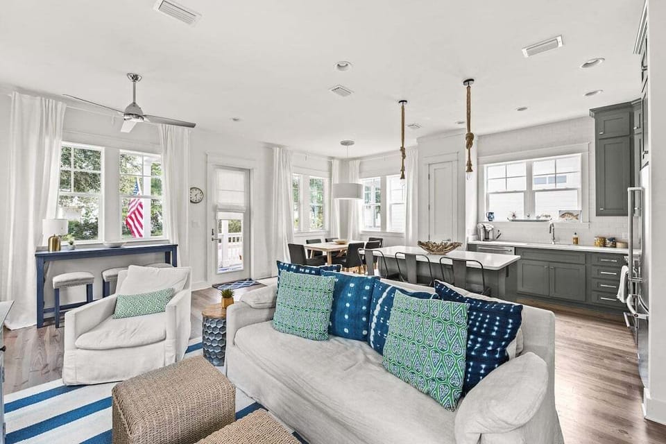 Living room open to dining room and kitchen with island with eat in breakfast bar