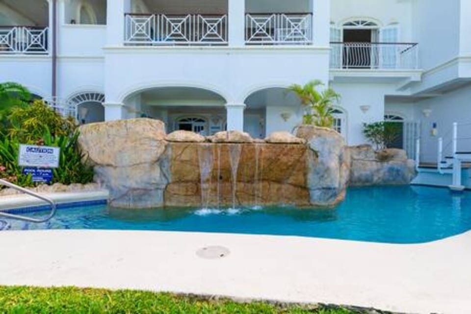 Fabulous communal pool within the tropical gardens allows guest to enjoy a relaxing dip.
