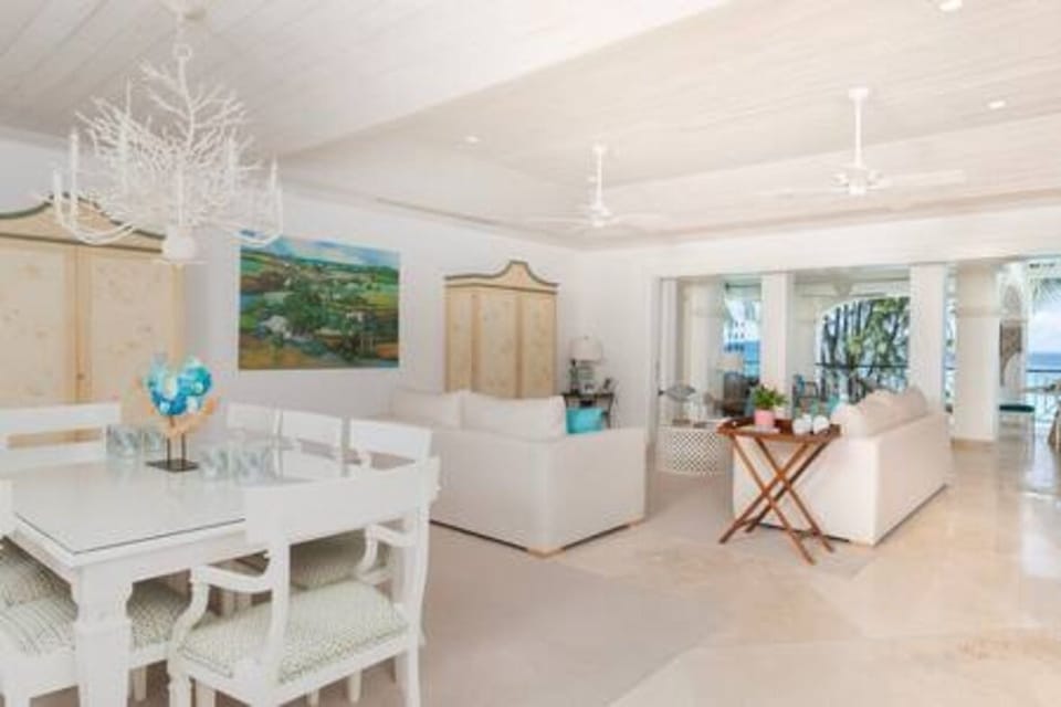 Open plan inside dining area with seating for 8 people and within close proximity of the kitchen area.
