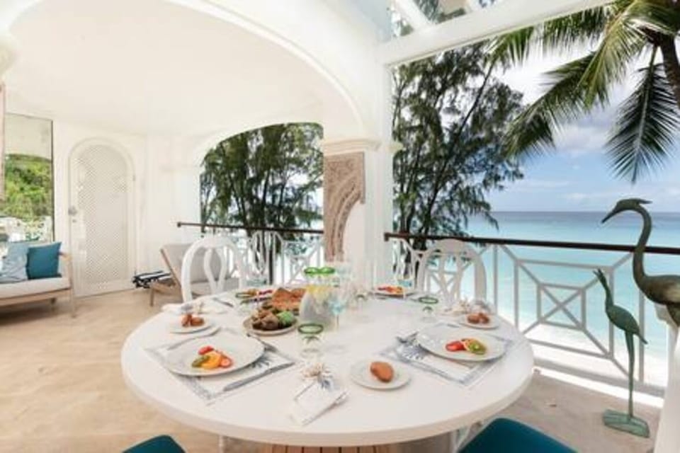 Beautiful dining area within the balcony area. This space has stunning, uninterrupted views of the sea and is a perfect place to entertain and relax.