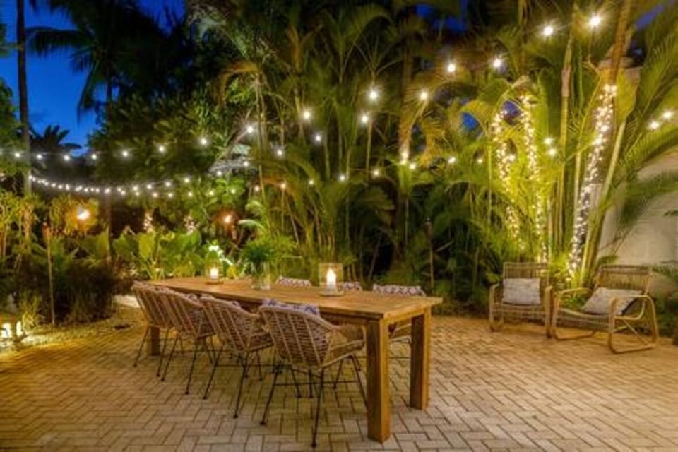 Stunning outdoor dining area, positioned perfectly amongst the beautifully maintained private garden.