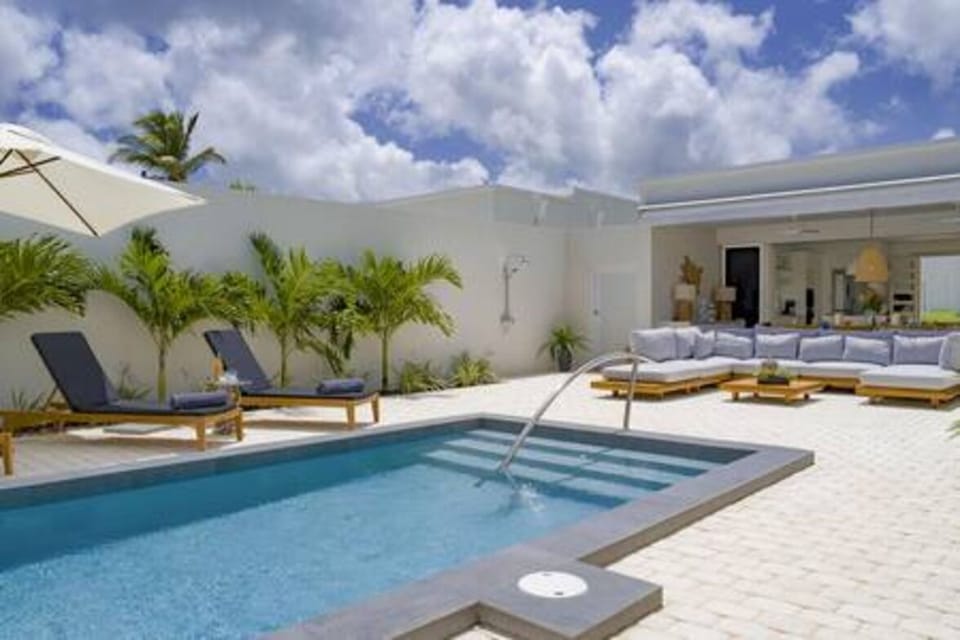 Private pool with outdoor sofa, dining and sun loungers. An outdoor shower is also provided for your convenience.