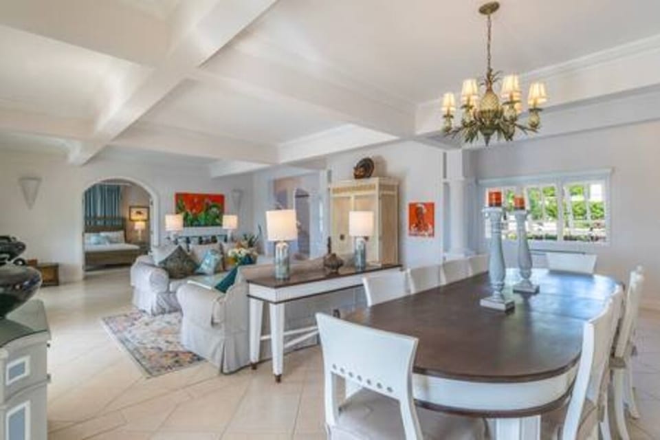 Open plan dining area with space for 10 guests in an air conditioned space.