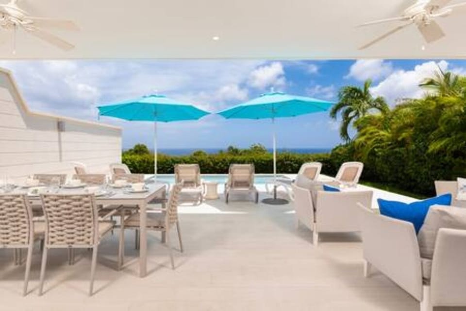 Private pool area with sun loungers and majestic views out to sea.