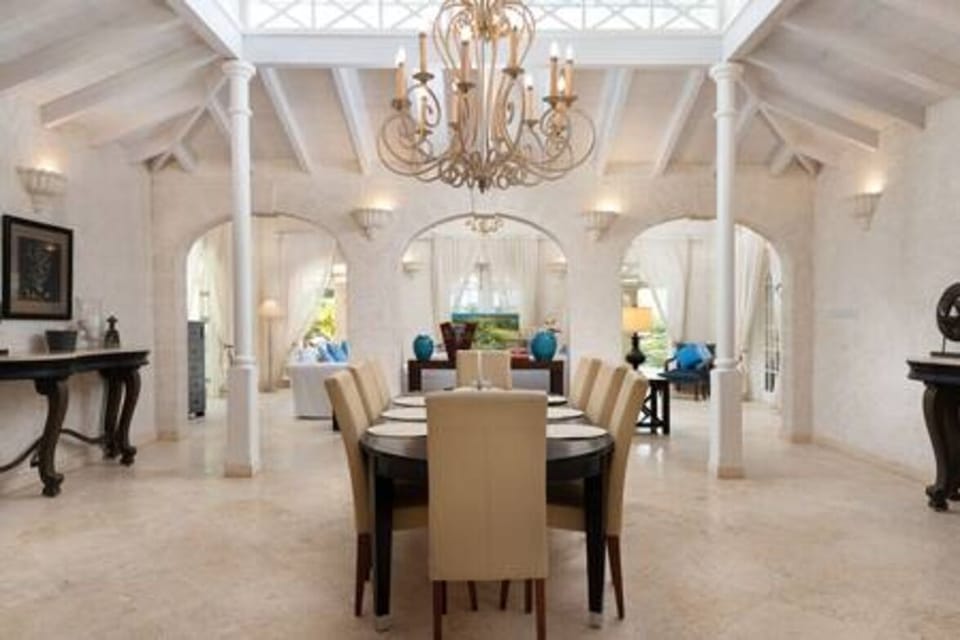 Stunning dining room with high ceilings.
