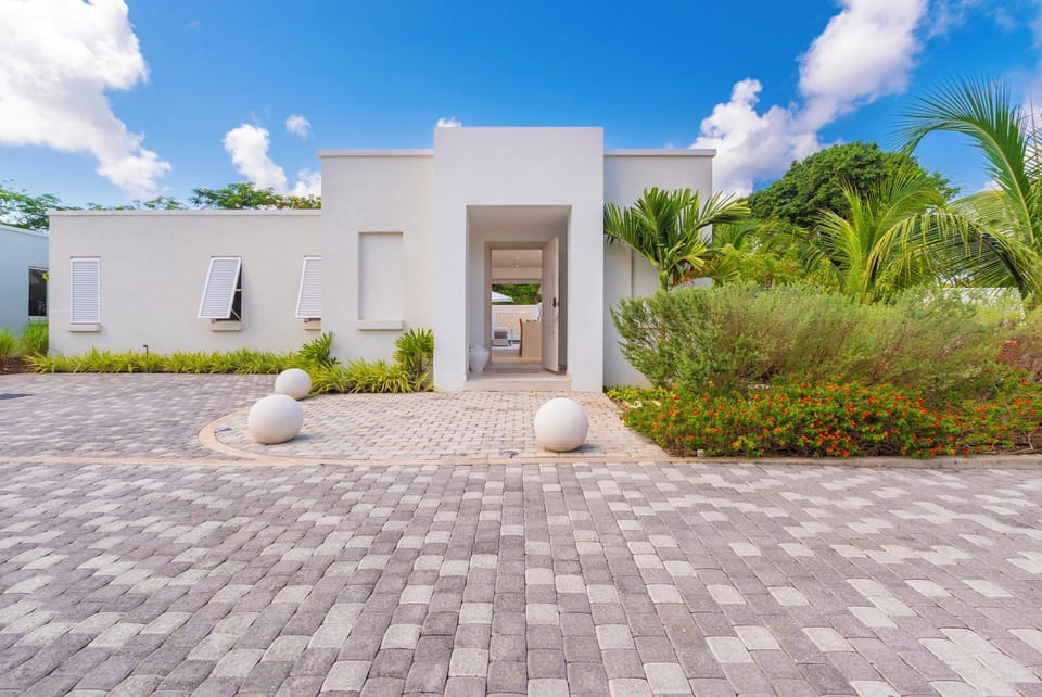 A spacious frontage provides private parking for up to 2 cars.