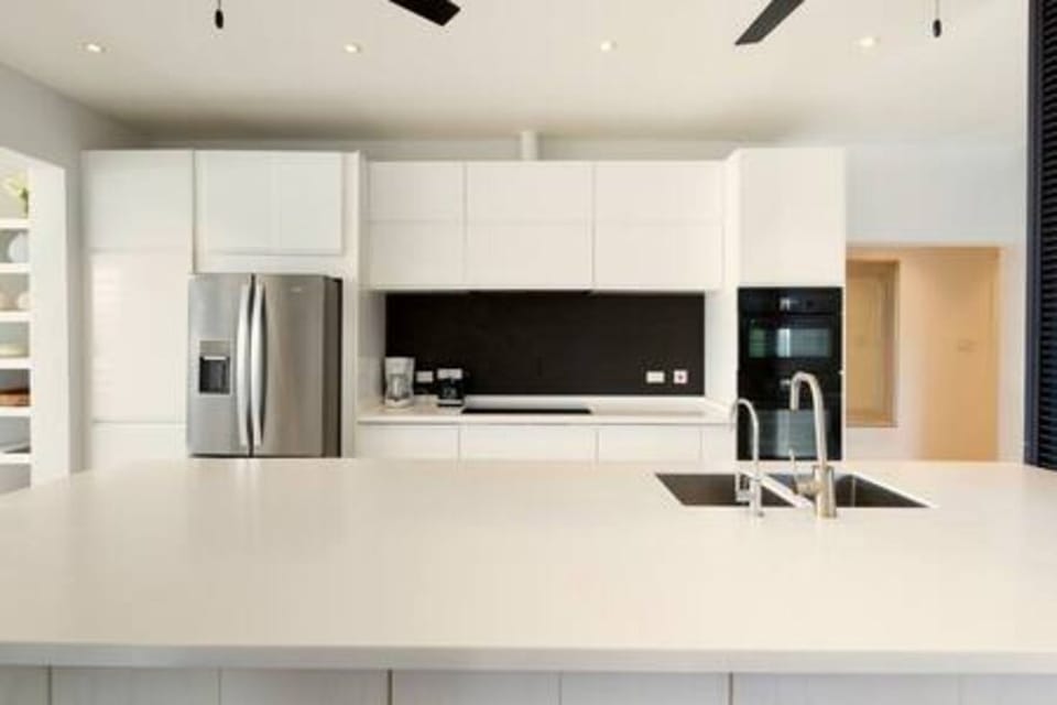 Well appointed kitchen including breakfast bar, coffee maker, wine fridge. 