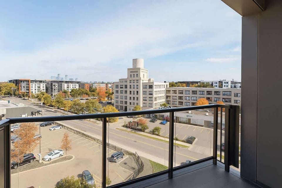 Step out to your private balcony with open city views — the perfect spot to unwind or enjoy a sunset drink.