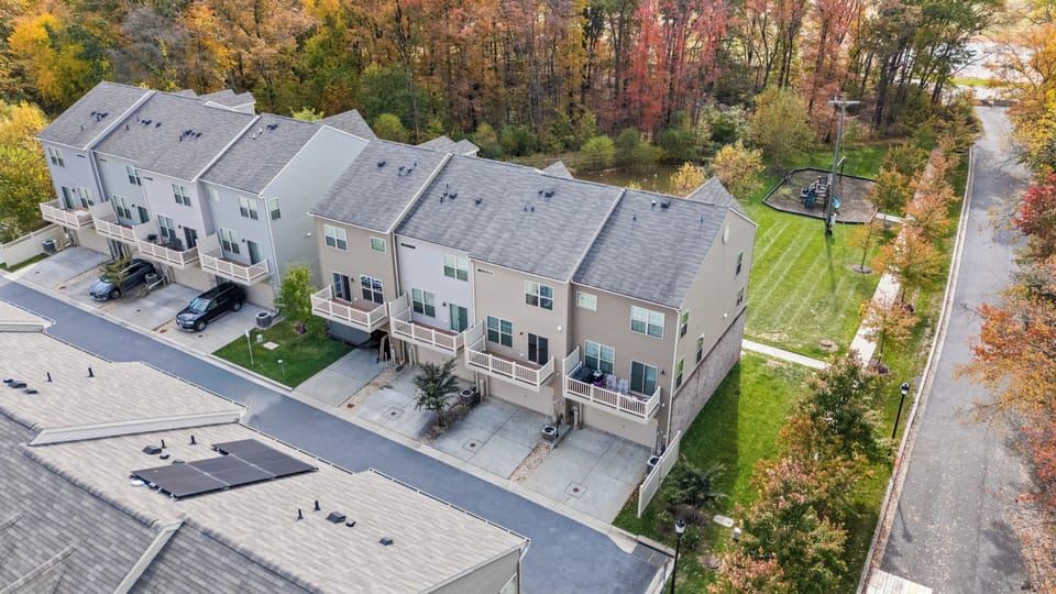 Arial view of back upper deck and garage