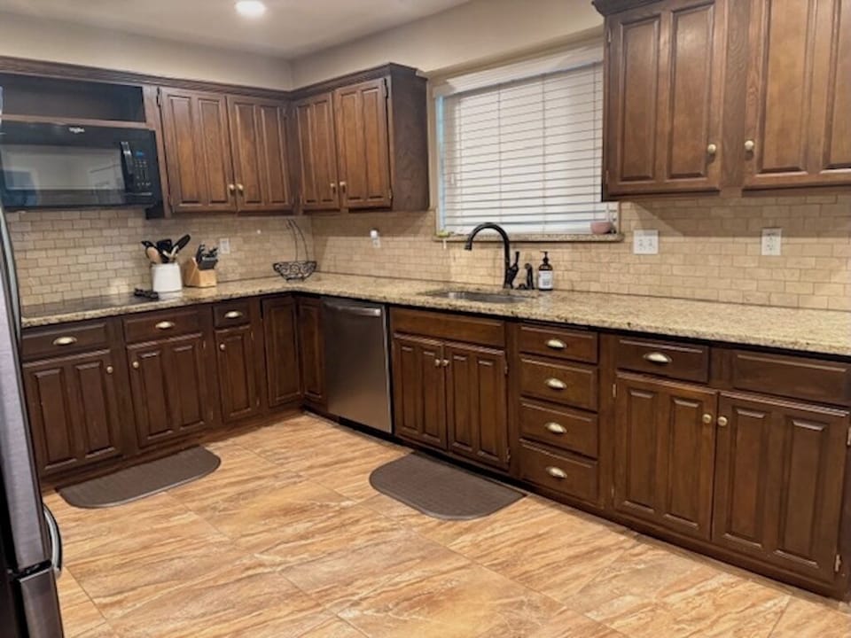Modern appliances and sleek countertops throughout