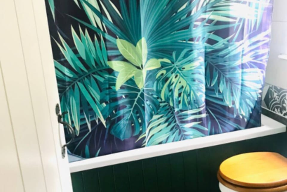 Bathroom on first floor, toilet, sink, bath & shower