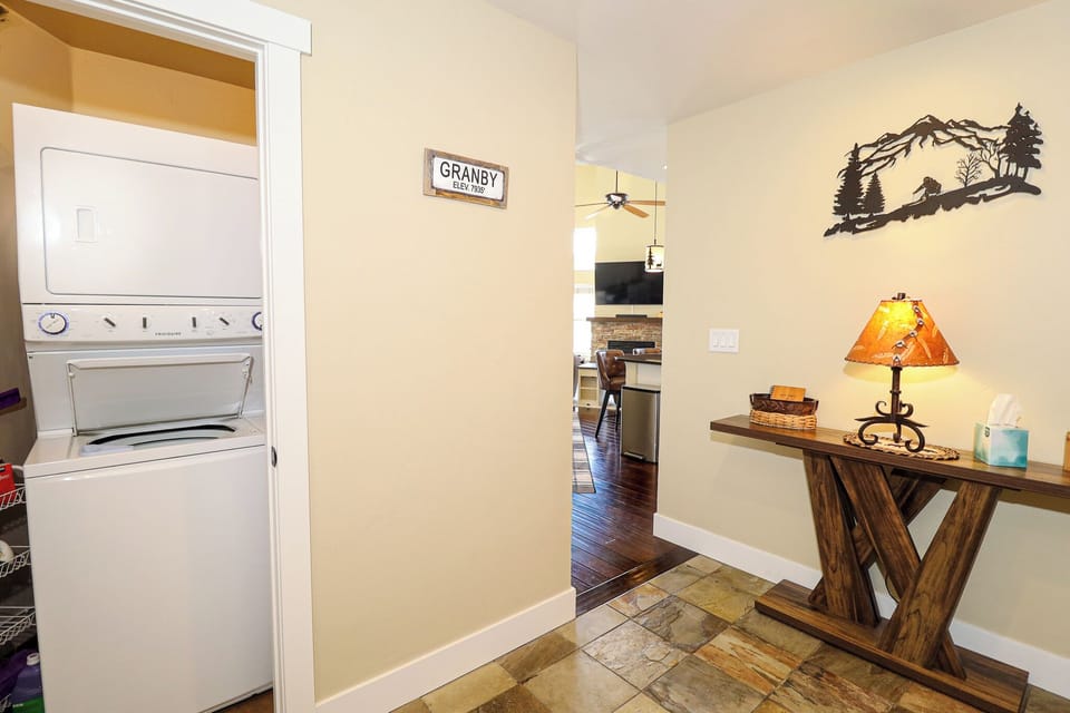 Entryway Featuring Stacked Washer & Dryer