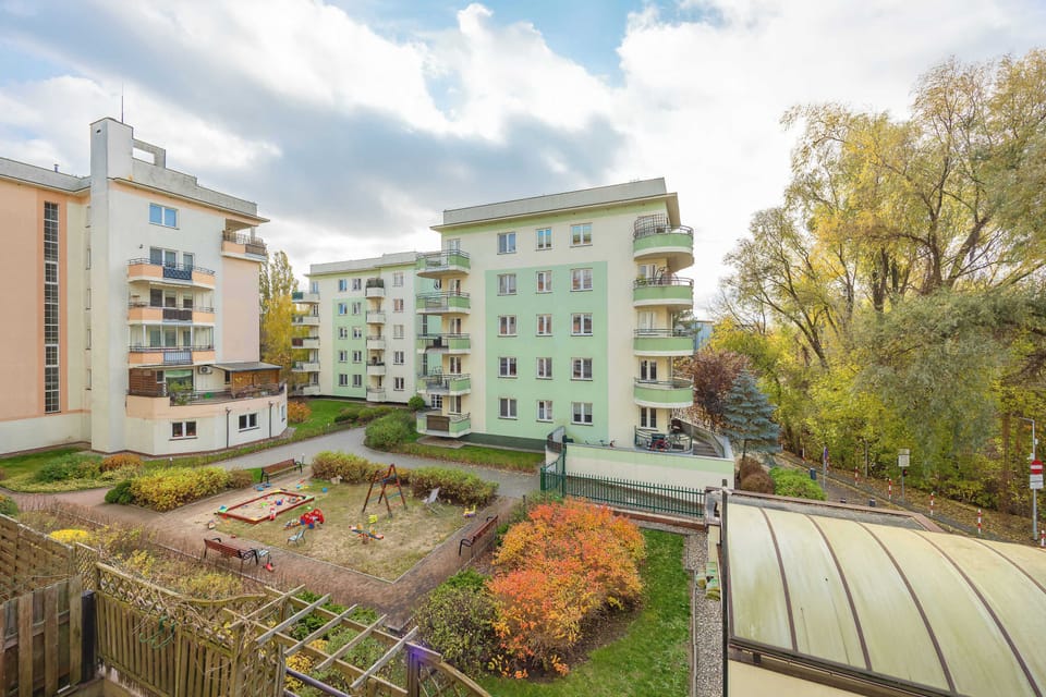 View of the inner courtyard filled with trees and shrubs allows you to enjoy peace right in the city center.