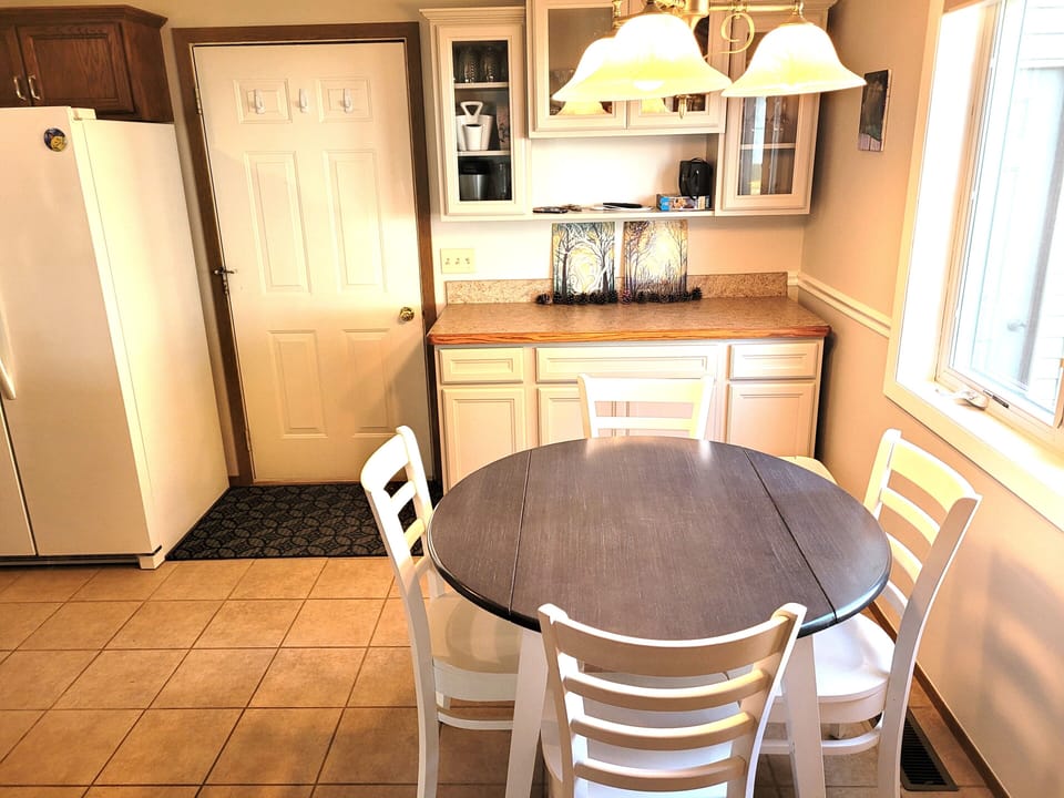 DINING AREA:  The home has a circular dining table with seating for up to 4 adults