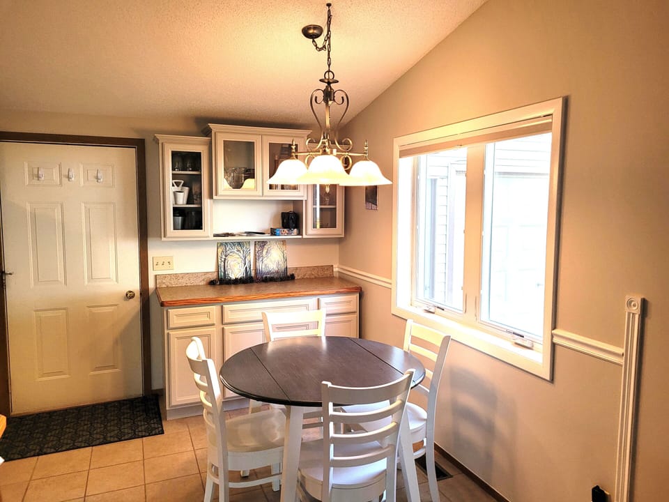 DINING AREA:  The home has a circular dining table with seating for up to 4 adults