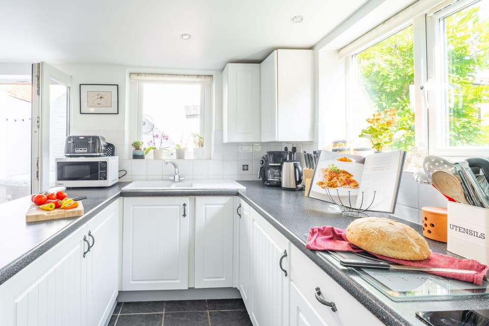 Ground floor: Bright triple aspect kitchen