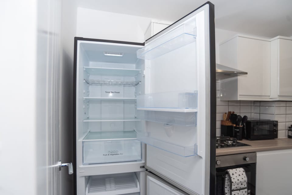 Large, clean fridge ideal for storing weekly groceries during longer work stays.