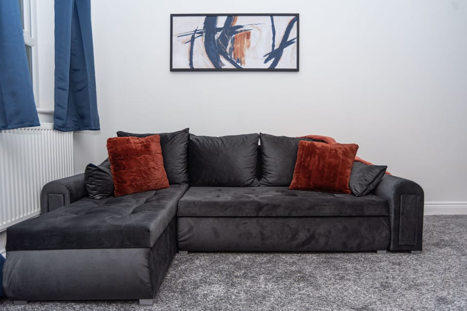 Practical and comfortable sofa bed, perfect for flexible group accommodation.