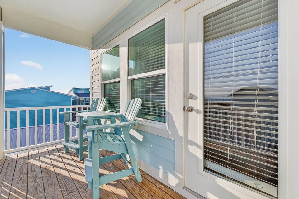 Private balcony with seating—enjoy morning coffee or unwind with coastal breezes.
