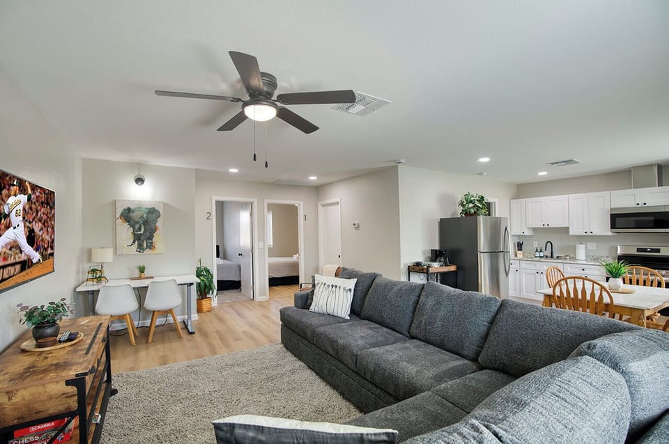 Relax in this spacious living room—your stay helps feed families in need.