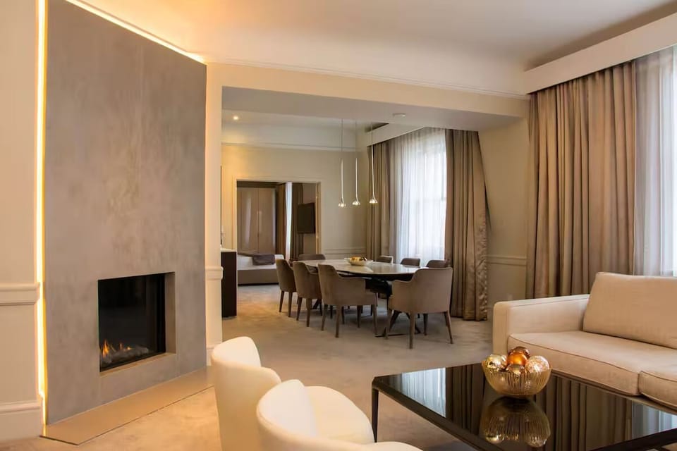 Unwind by the glowing fireplace after a day exploring.