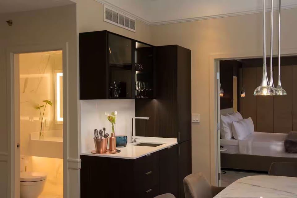 Refresh drinks and snacks easily in the sleek kitchenette.